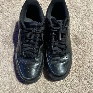 Nike Black Sneakers with Leather Upper and Perforated Toe
